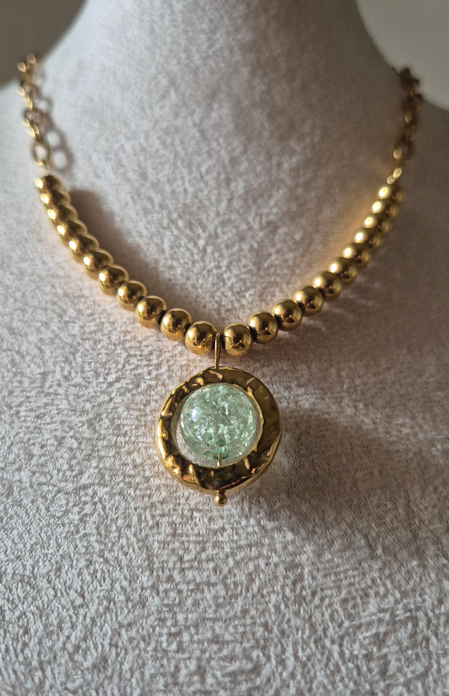 Collier acier doré avec pendentif