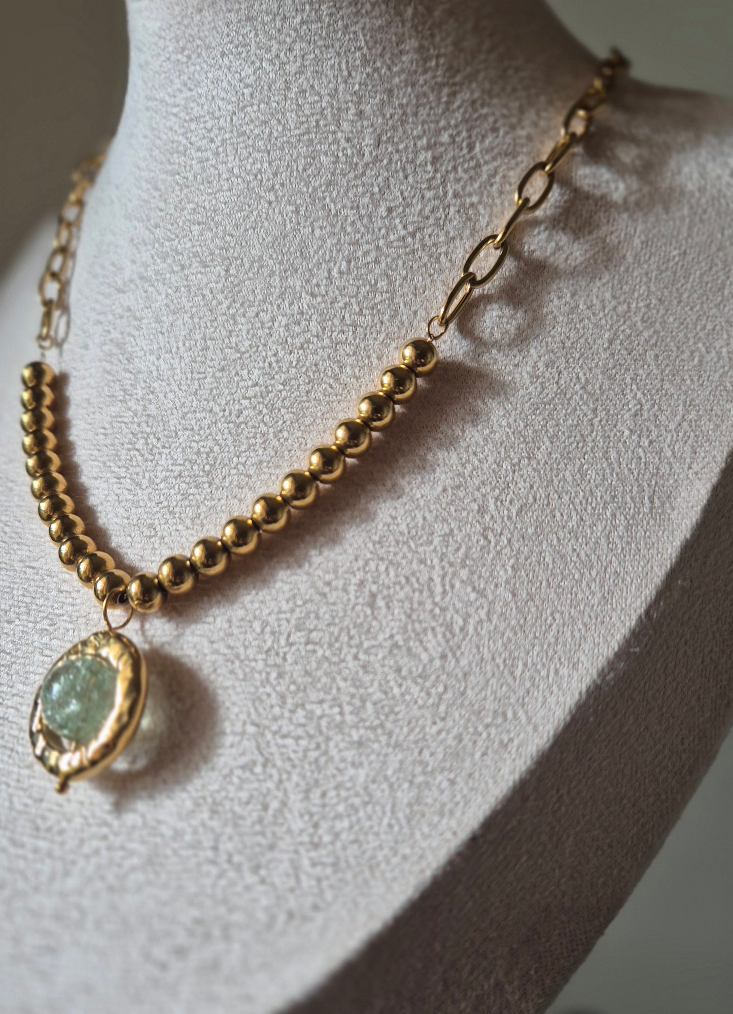 Collier acier doré avec pendentif